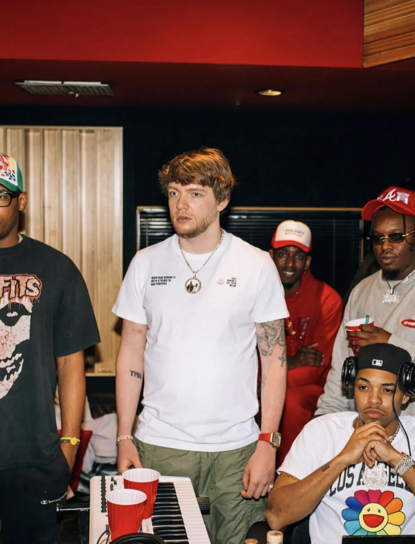 CJ WestCoast in the studio with his production crew